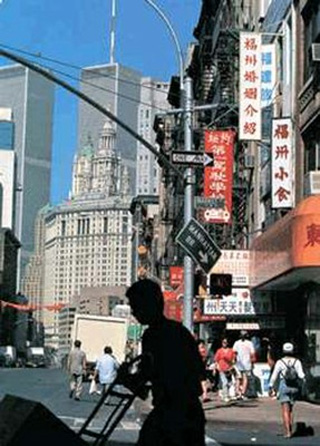 An American city street with Chinese signs. An American city street with Chinese signs.